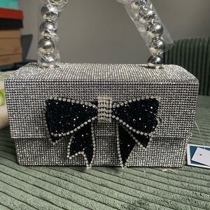 Elegant Silver and Black Bow Clutch